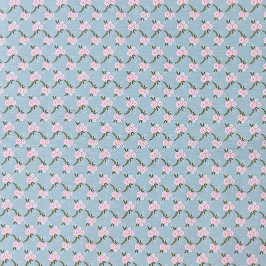 Tessuto Cotonina Roseto Sfondo Azzurro | 100% Cotone | Altezza 140 cm